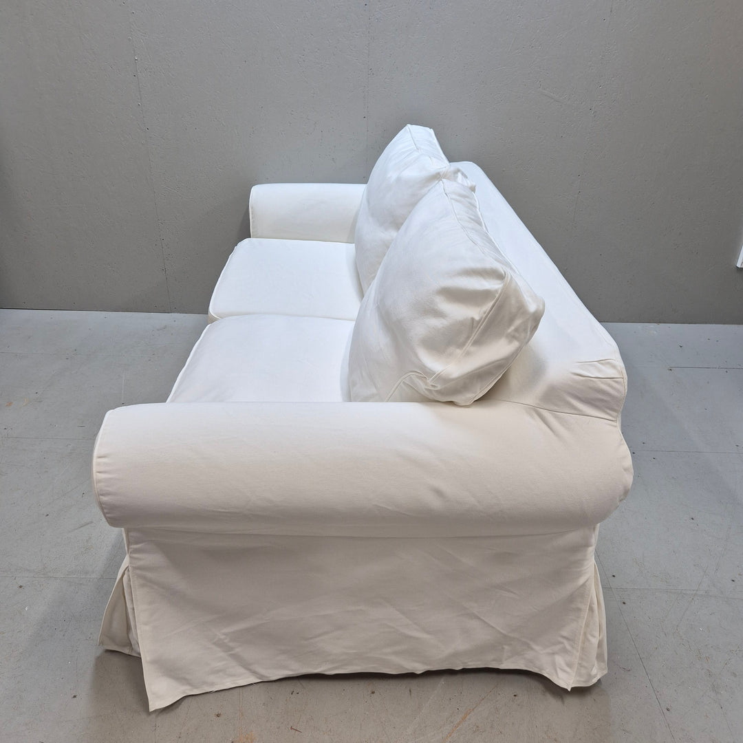 Elegant vit bäddsoffa i tyg i gott skick