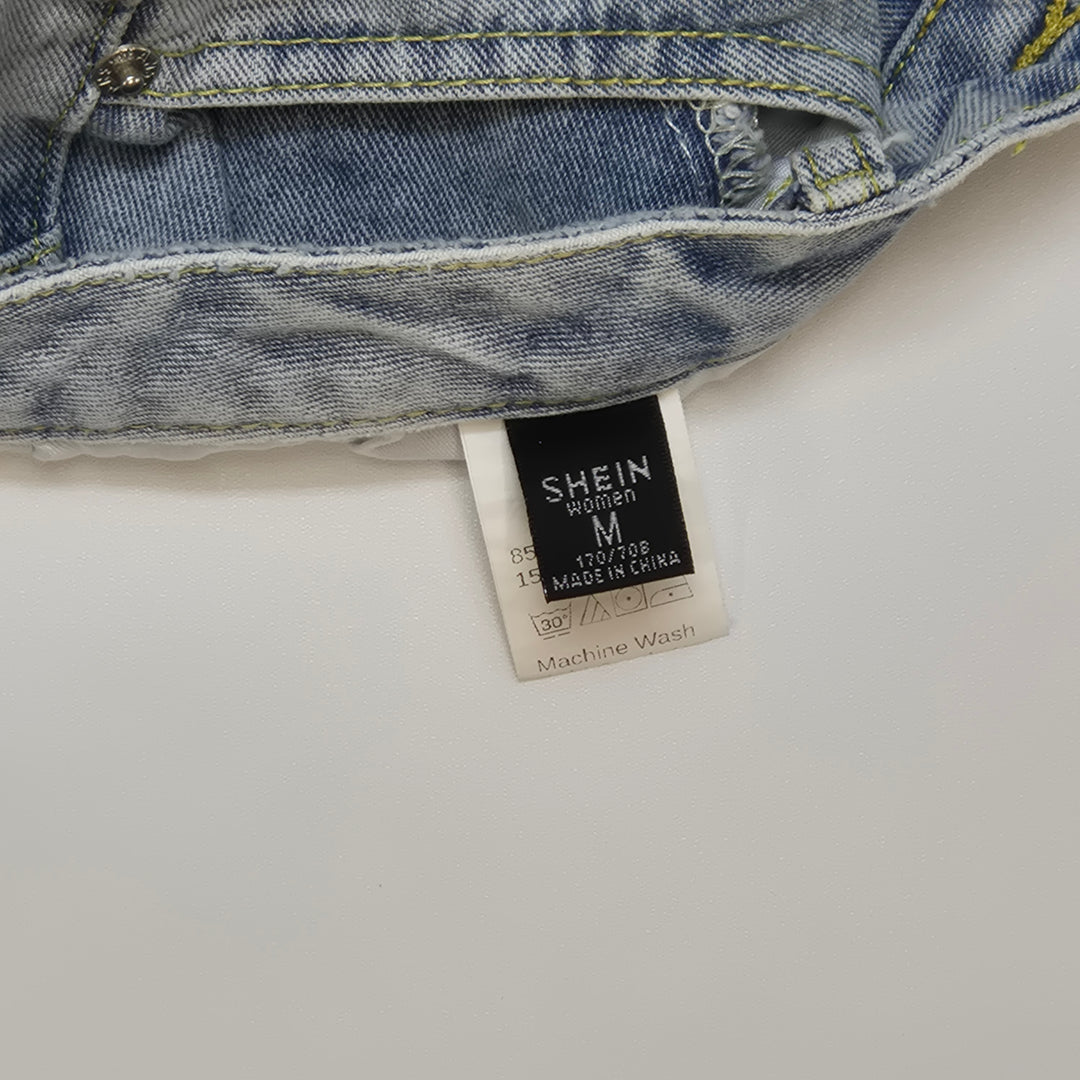 Retro jeans med färgstänk i ljus denim