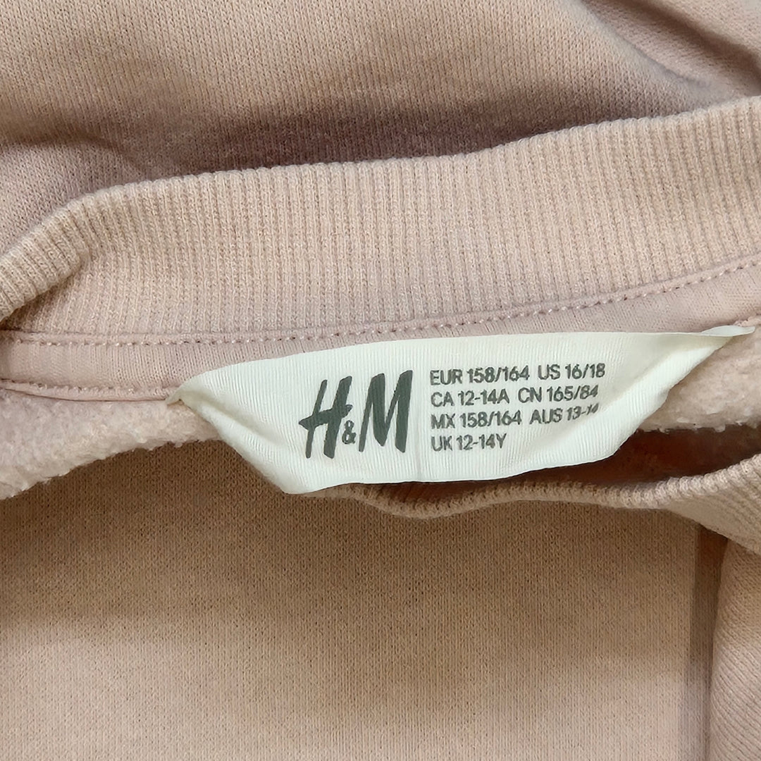 H&M ljusrosa tröja med silvriga pailletter
