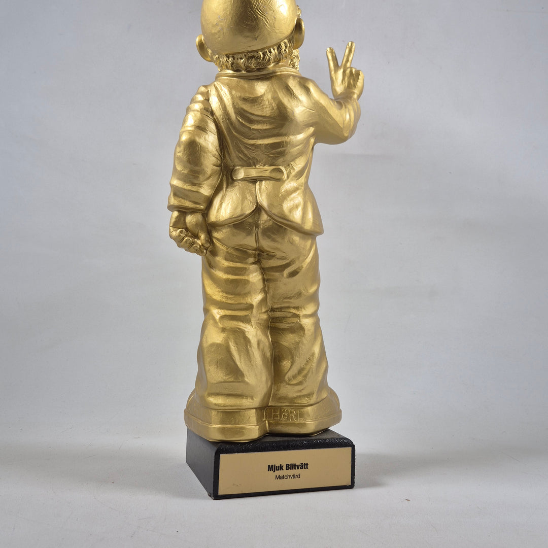 Unik guldfärgad astronautfigur i metall