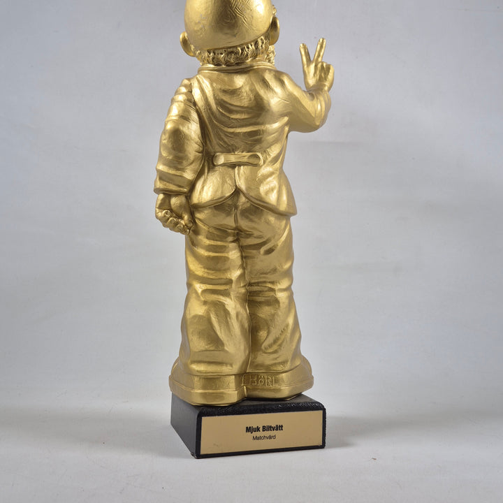 Unik guldfärgad astronautfigur i metall