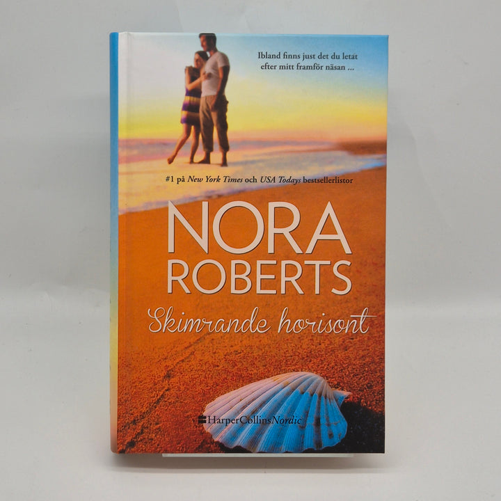 Nora Roberts bok Skimrande horisont begagnad