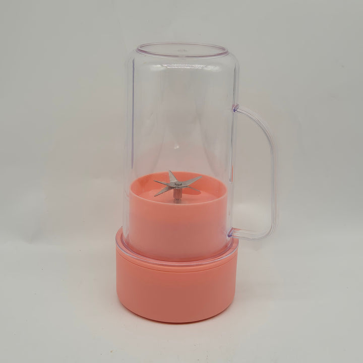 Färgglad korallfärgad smoothie-blender i gott skick