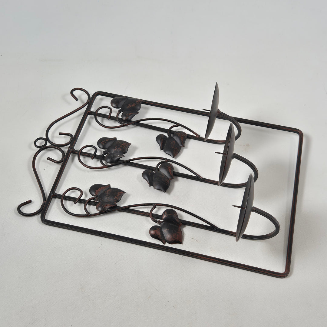 Vintage ljushållare i metall med fågelfigurer