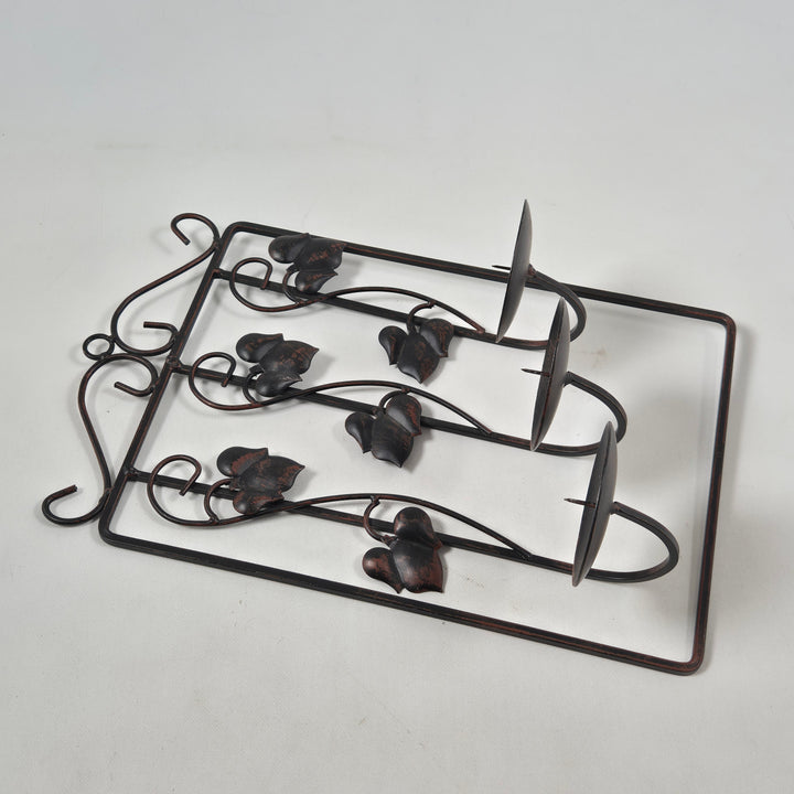 Vintage ljushållare i metall med fågelfigurer