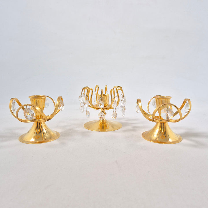 Elegant guldljusstake med kristalldetaljer