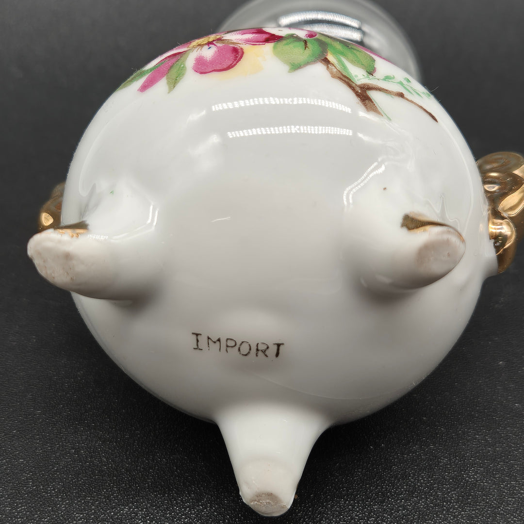 Retro oljelampa med blommig design i porslin