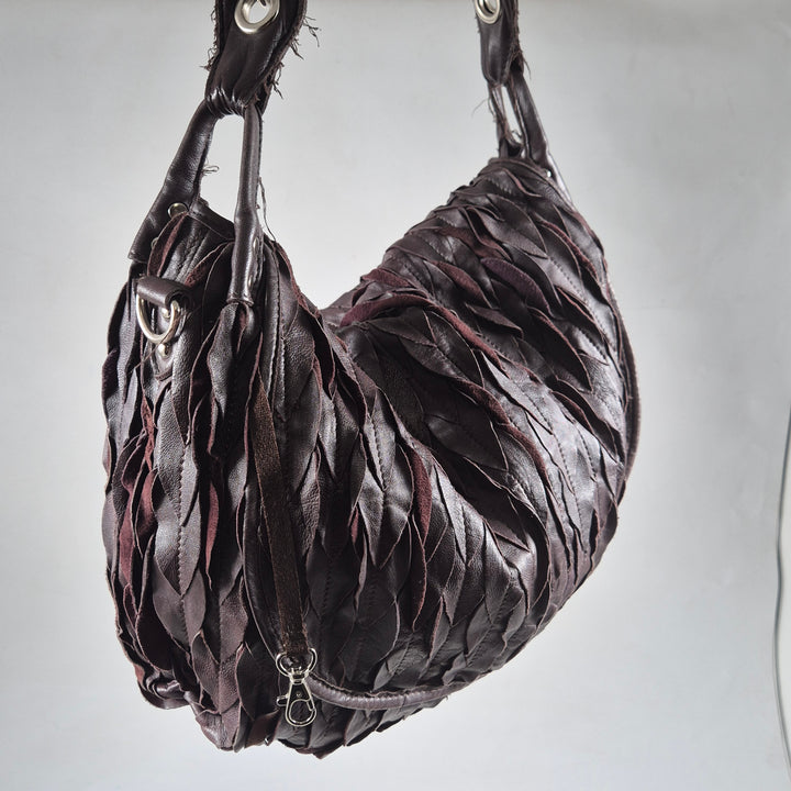 Elegant mörklila läderhandväska