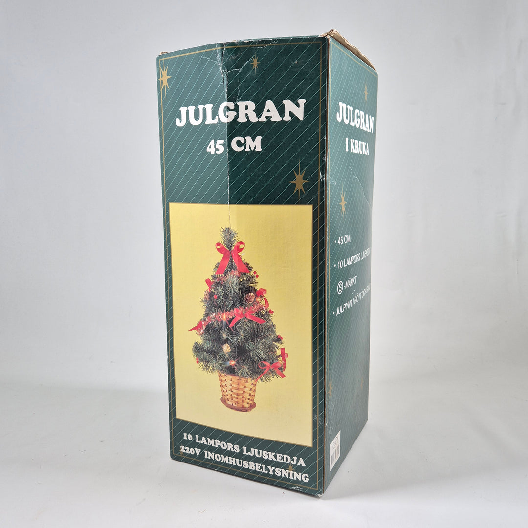 Charmig julgran i kruka med belysning