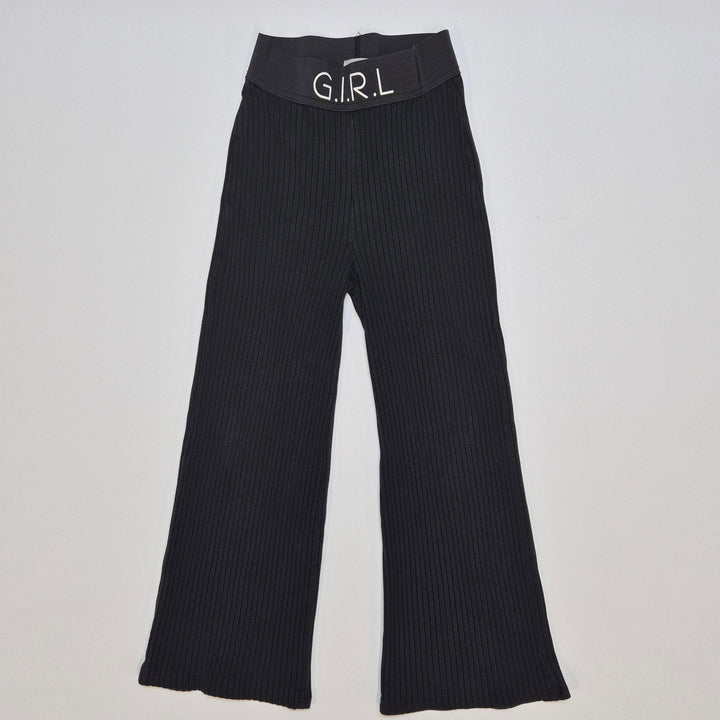 Svarta ribbade utsvängda byxor G.I.R.L - Homy Secondhand Online