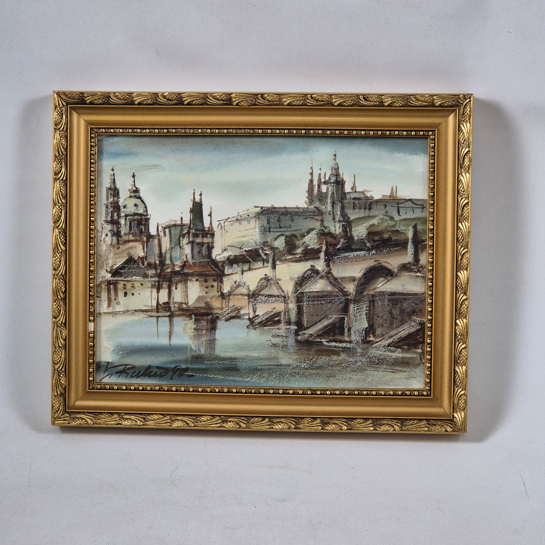 Inramad tavla av Prag i gyllene ram