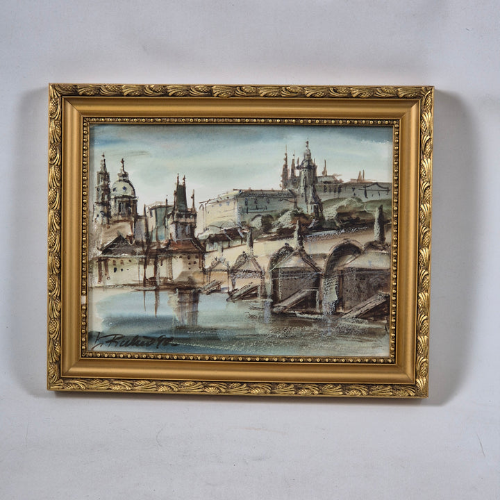 Inramad tavla av Prag i gyllene ram