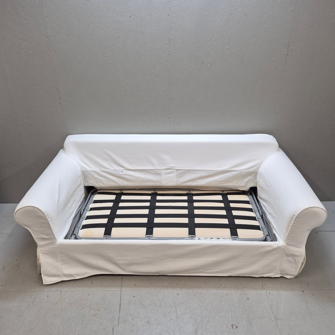 Elegant vit bäddsoffa i tyg i gott skick