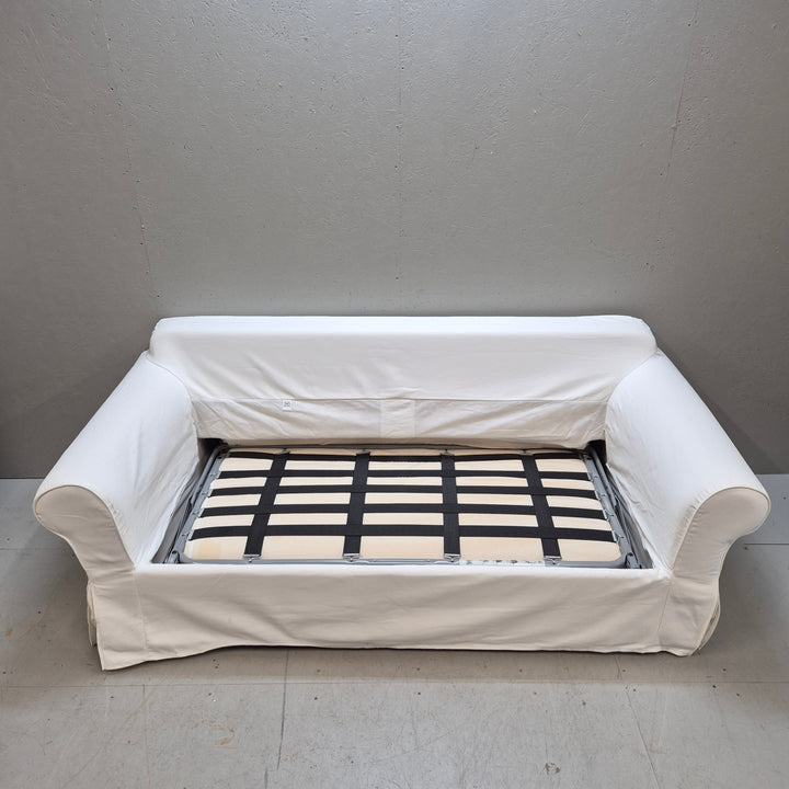 Elegant vit bäddsoffa i tyg i gott skick