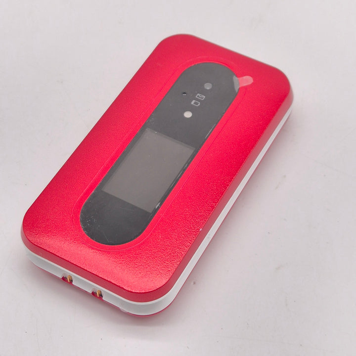 Röd Doro knapptelefon med trygghetsknapp