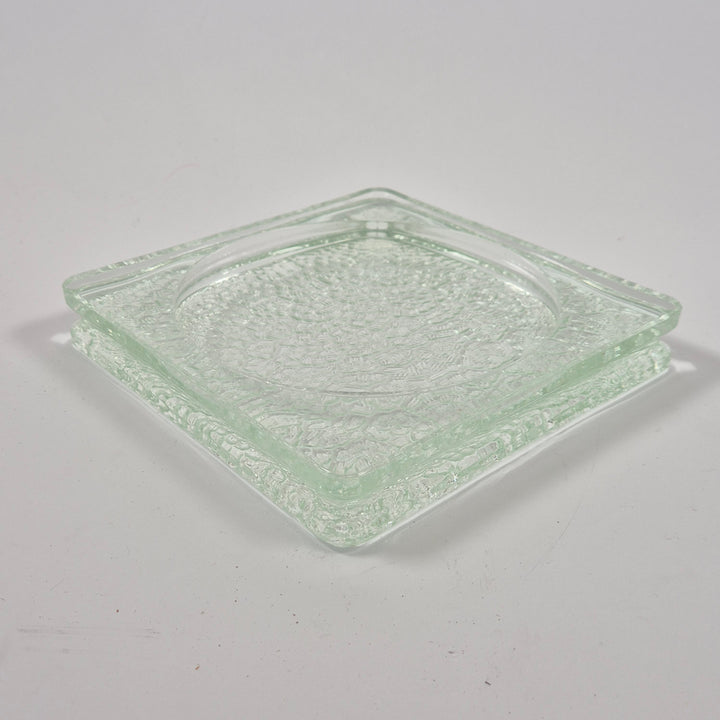 Elegant kvadratisk glasskål med strukturerad yta