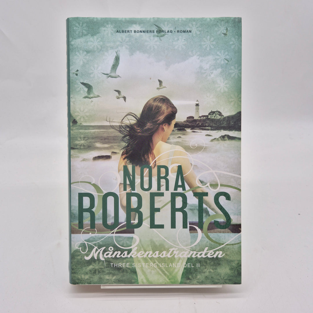 Månskensstranden bok inbunden Nora Roberts begagnad