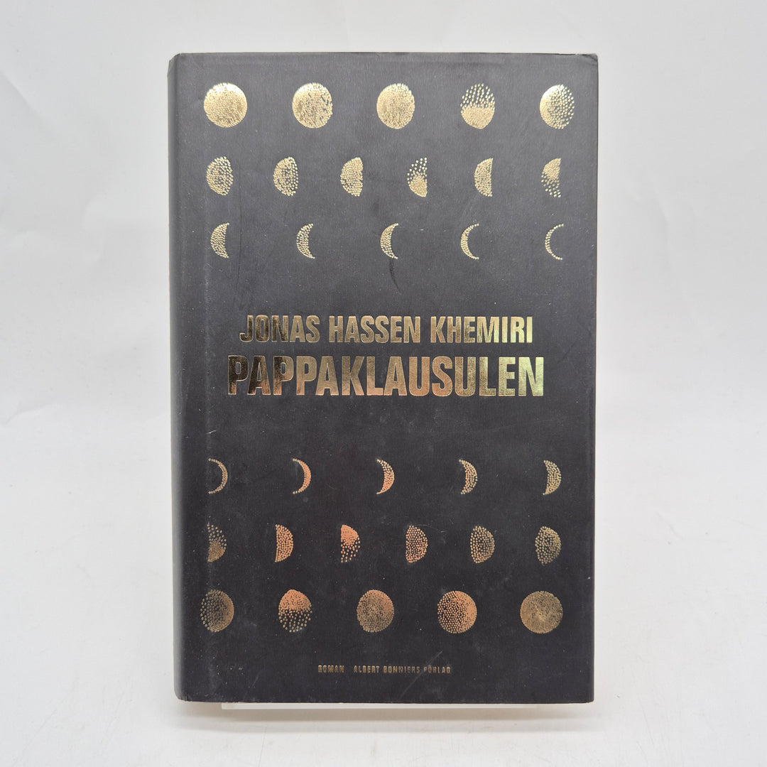 Pappaklausulen inbunden roman svart guld