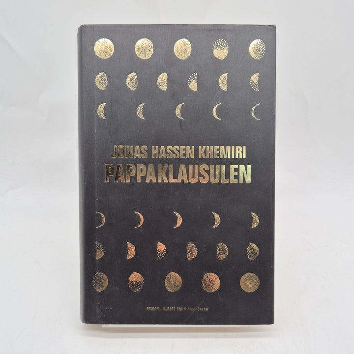 Pappaklausulen inbunden roman svart guld