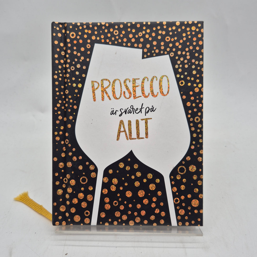 Prosecco presentbok glittrigt svart guld Tukan