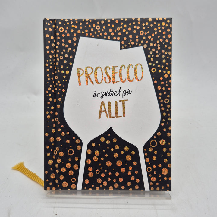 Prosecco presentbok glittrigt svart guld Tukan