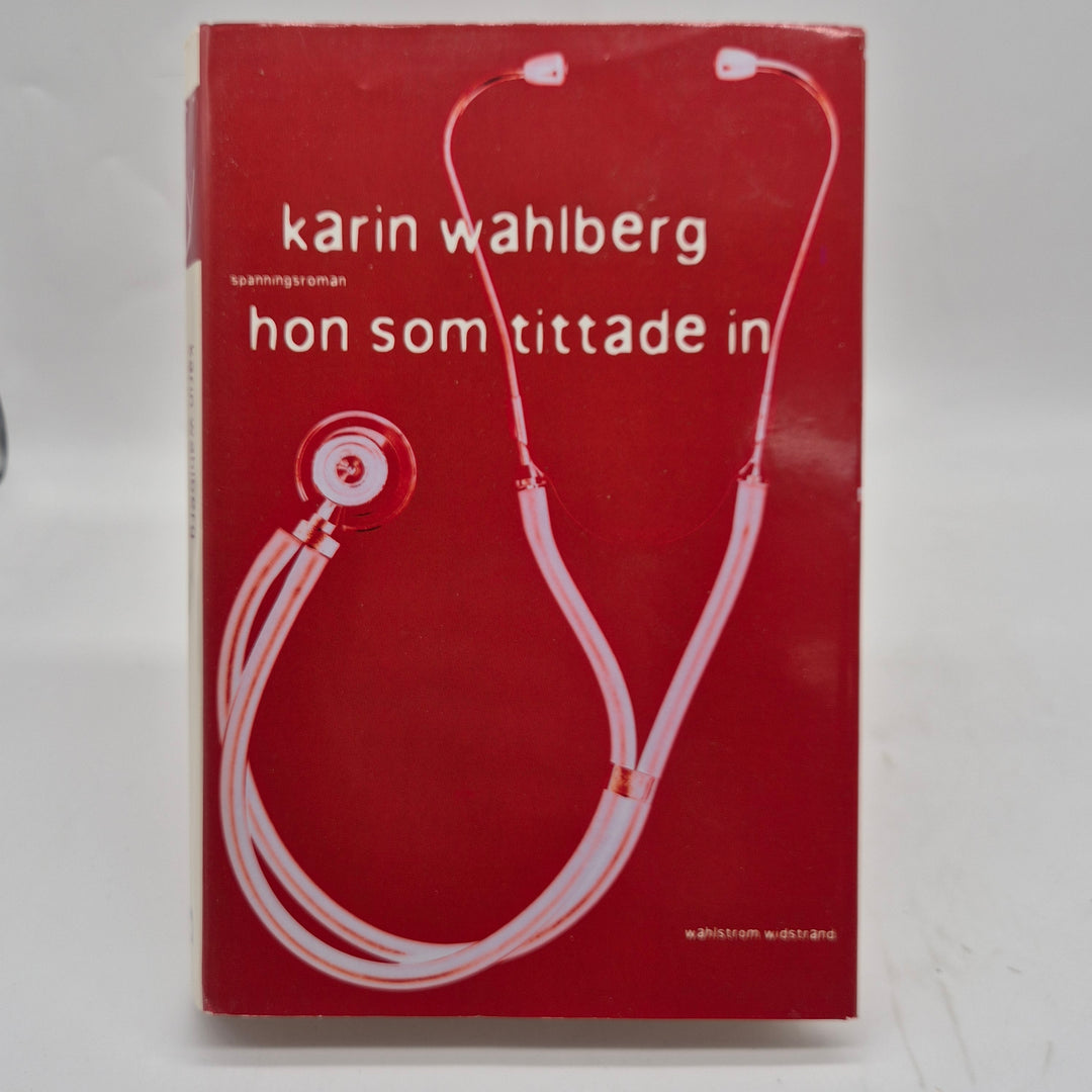 Hon som tittade in kriminalroman inbunden begagnad