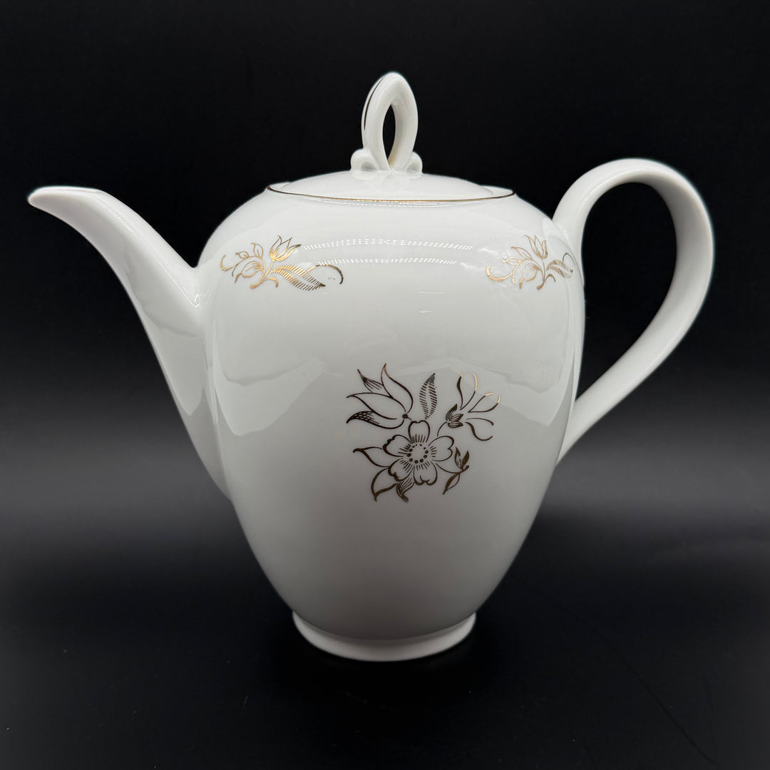 Retro porslinstekanna med blommigt mönster