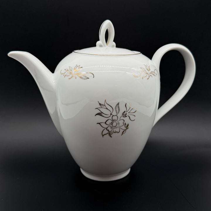 Retro porslinstekanna med blommigt mönster