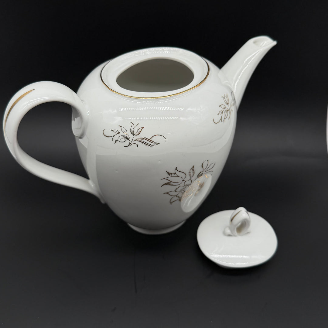 Retro porslinstekanna med blommigt mönster