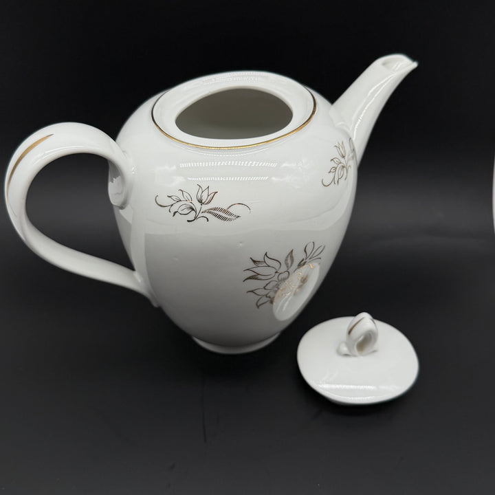 Retro porslinstekanna med blommigt mönster