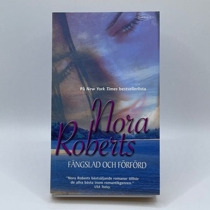 Nora Roberts Fångslad och förörd bok