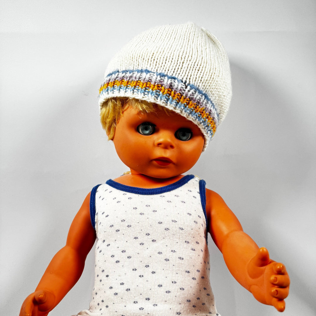 Vintage docka med stickad mössa och blå ögon - Homy Secondhand Online