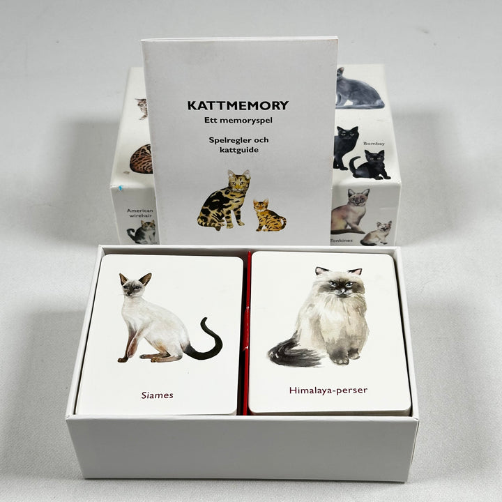 Kattmemory-spel med illustrerade rasmotiv