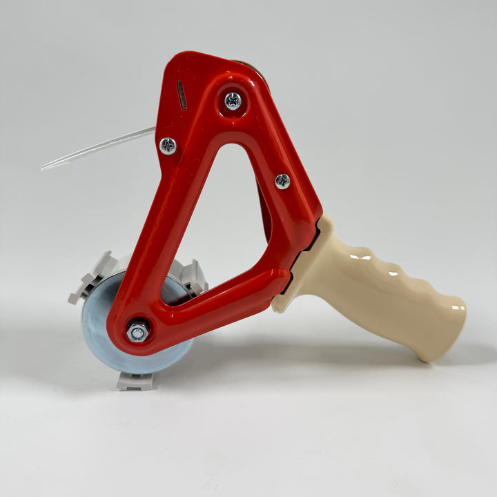 Praktisk röd etikettdispenser i plast och metall