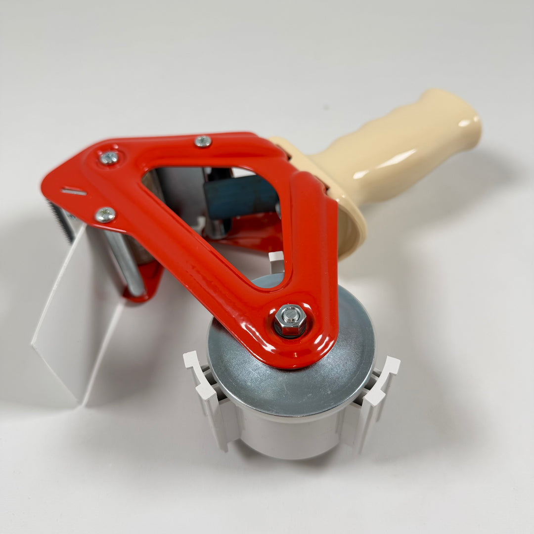 Praktisk röd etikettdispenser i plast och metall