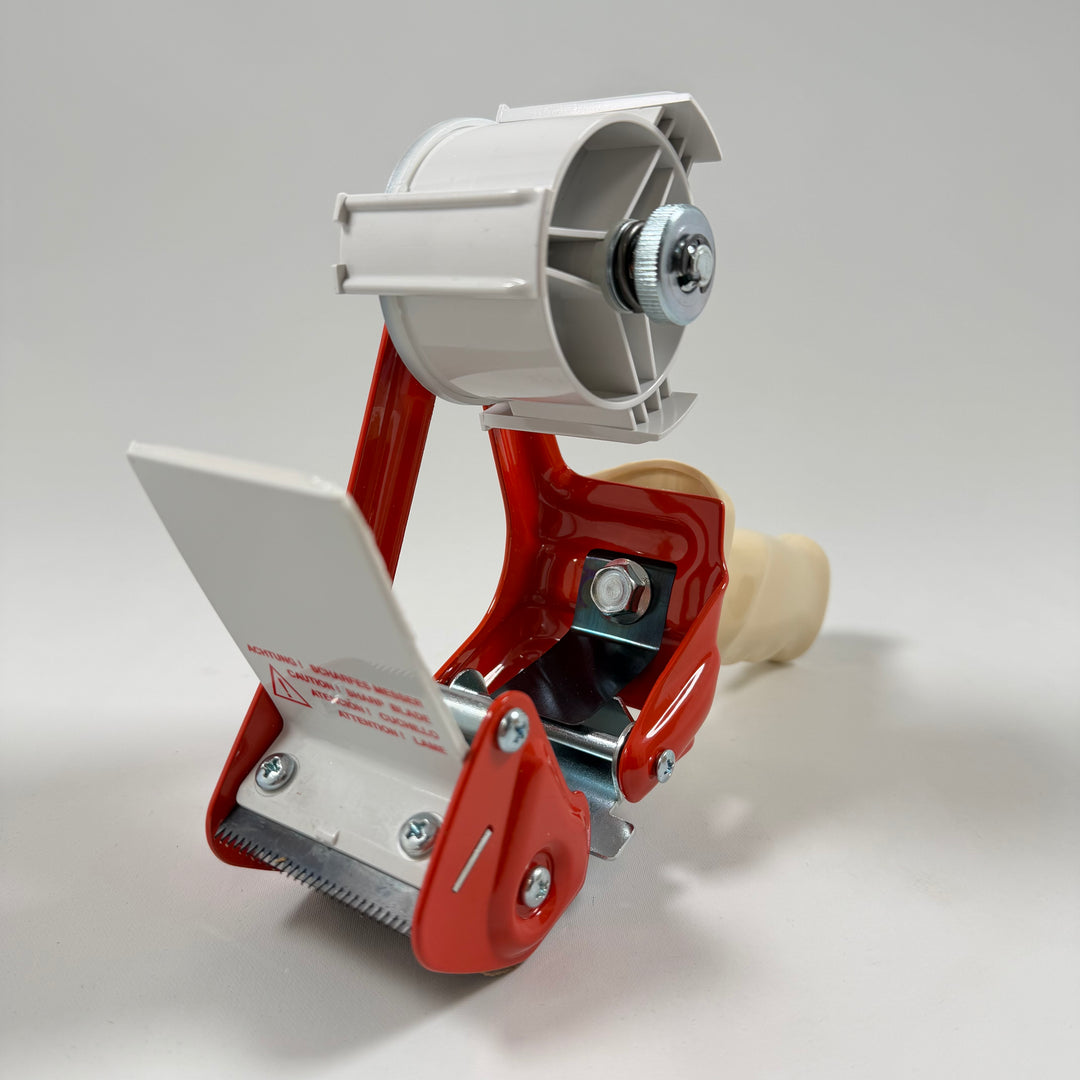 Praktisk röd etikettdispenser i plast och metall