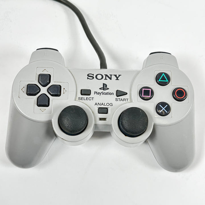 Retro grå Sony PlayStation handkontroll trådbunden