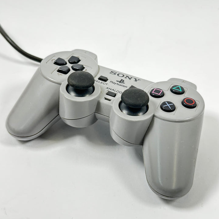 Retro grå Sony PlayStation handkontroll trådbunden