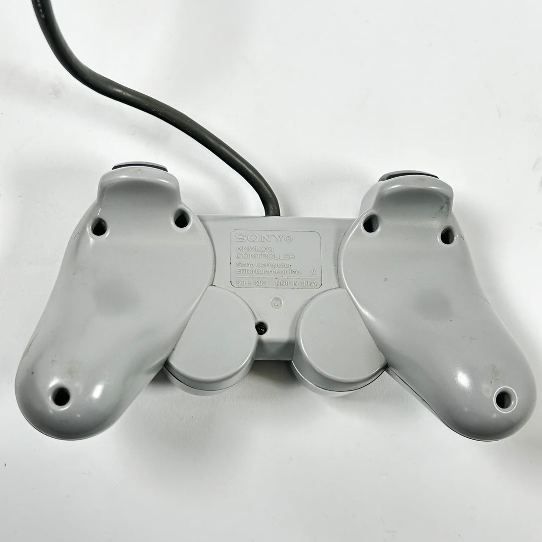Retro grå Sony PlayStation handkontroll trådbunden
