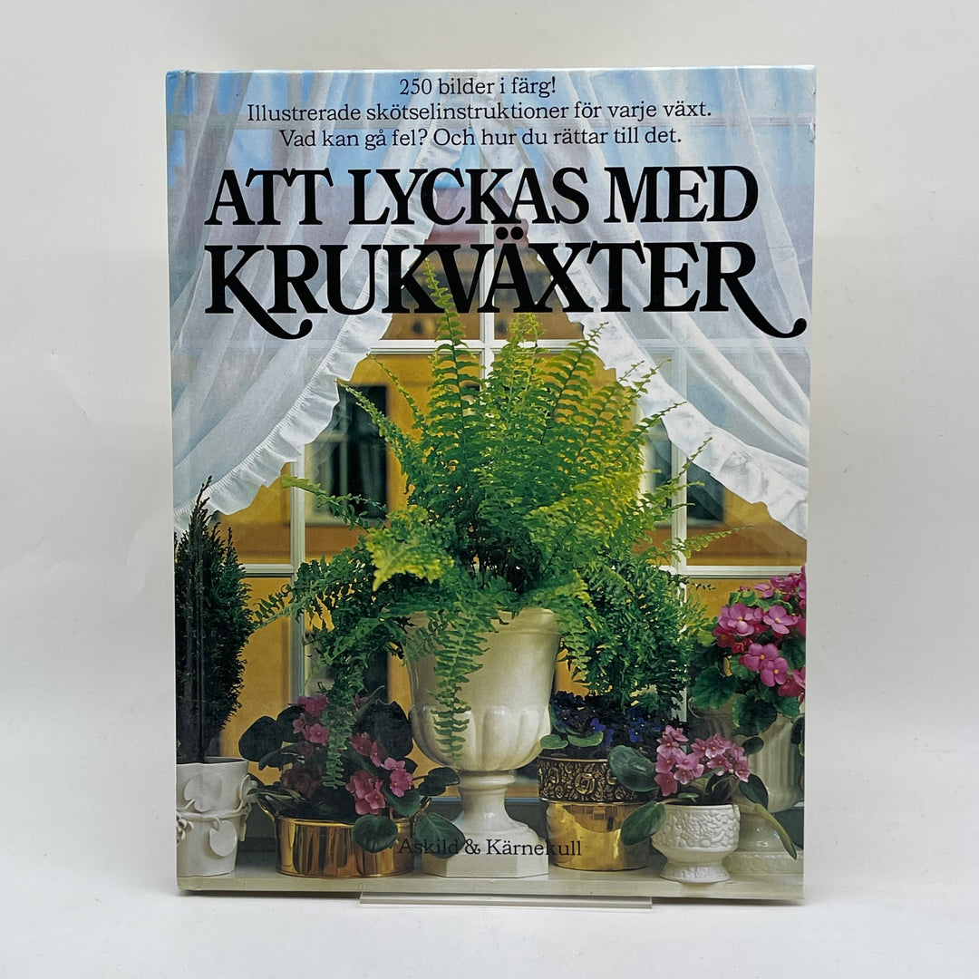 Bok om krukväxter med färgbilder