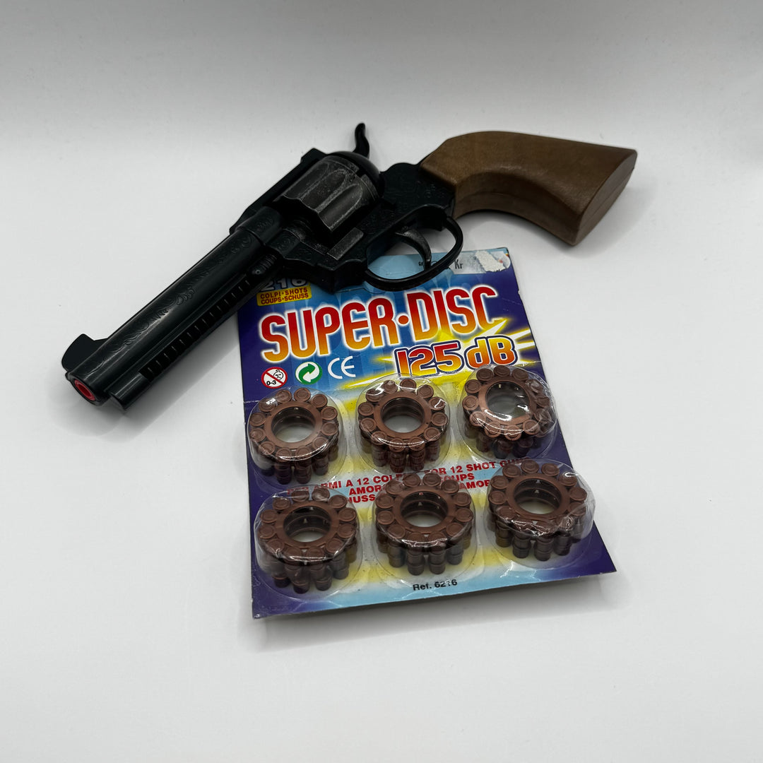 Retro leksakspistol i svart och brun plast