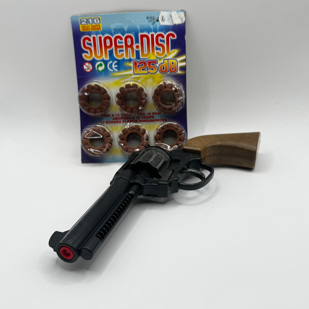 Retro leksakspistol i svart och brun plast