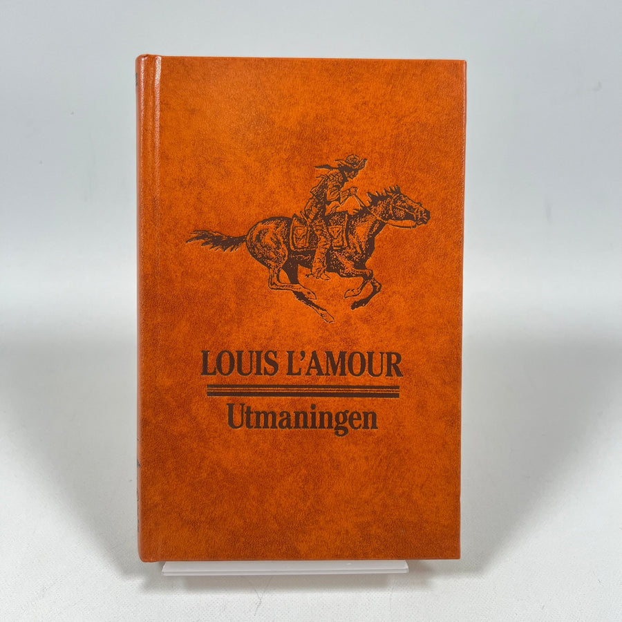 Orangefärgad Bok med Västerntema av Louis L'Amour - Homy Secondhand Online