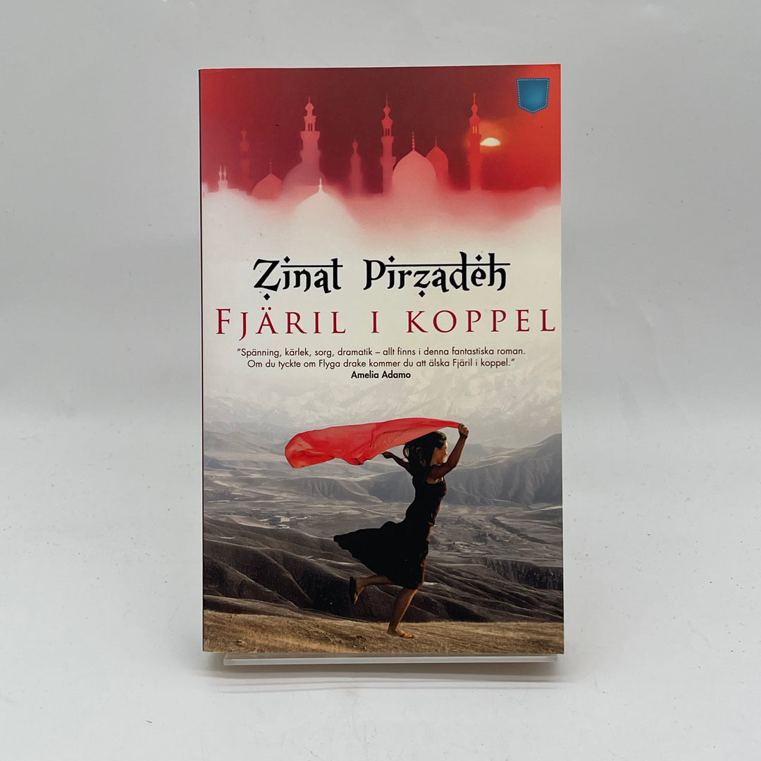 Fjäril i Koppel av Zinat Pirzadeh