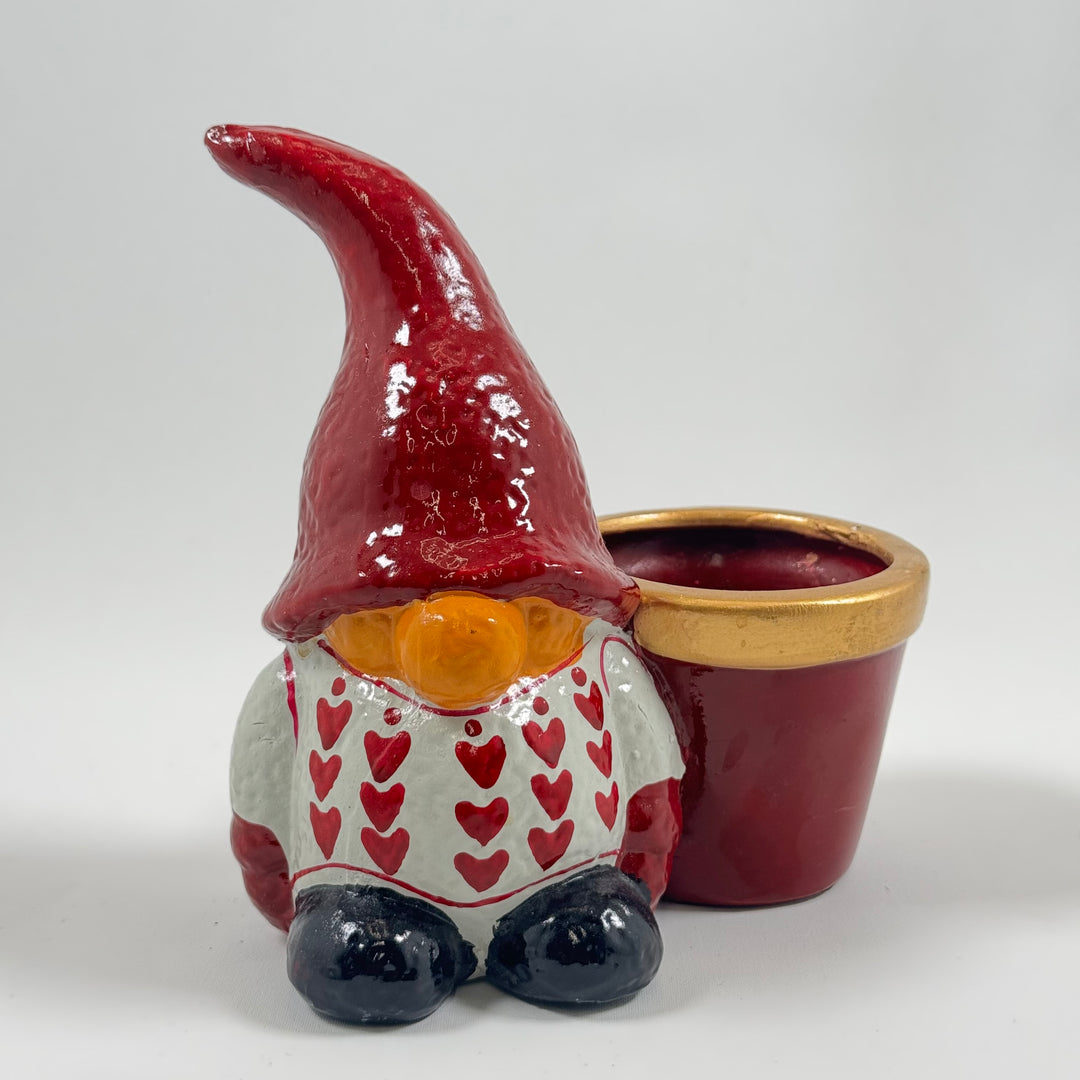 Färgglad keramiktomtekruka med hjärtmönster