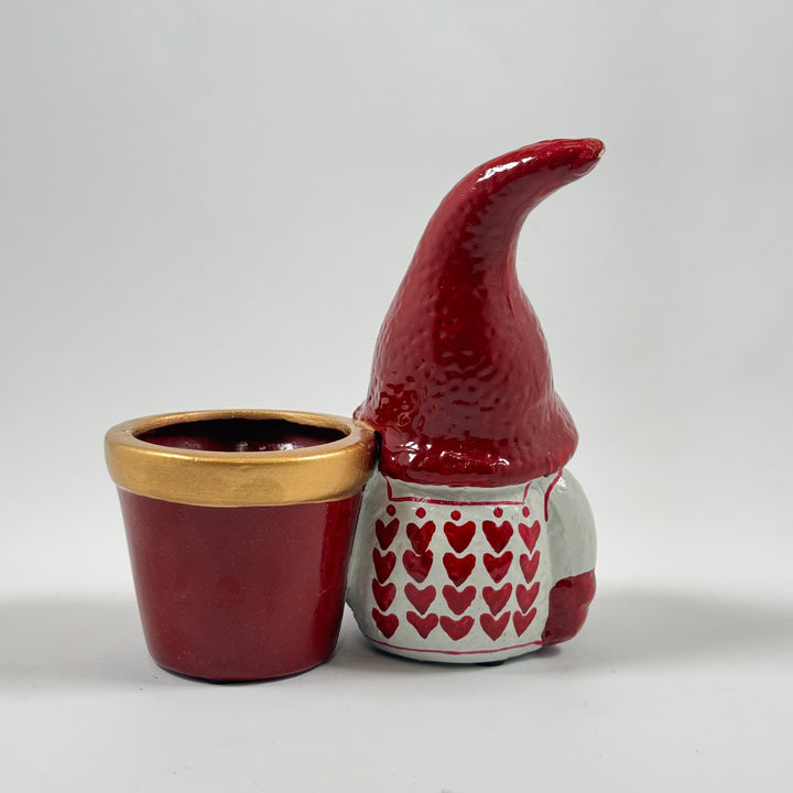 Färgglad keramiktomtekruka med hjärtmönster