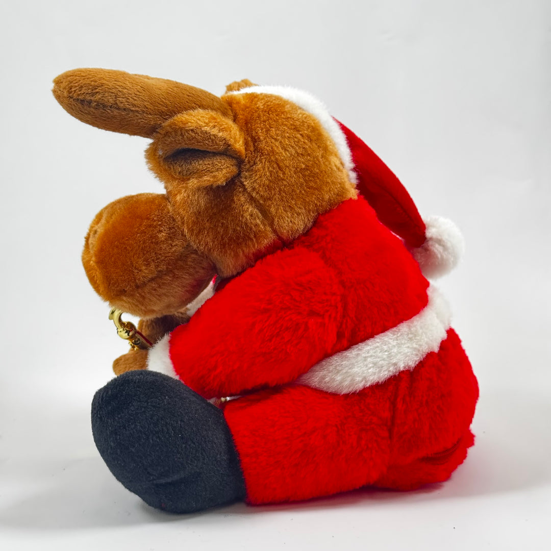 Julren i plysch med tomtedräkt och saxofon