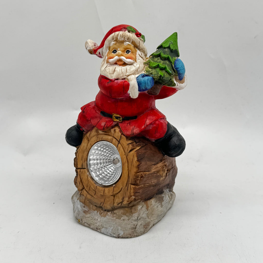 Dekorativ jultomtebelysning i resin från Rusta