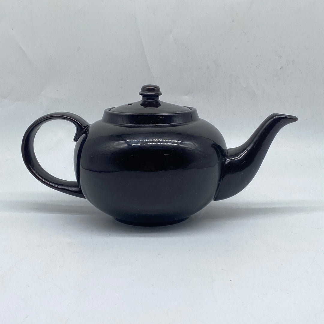 Elegant svart tekanna i keramik