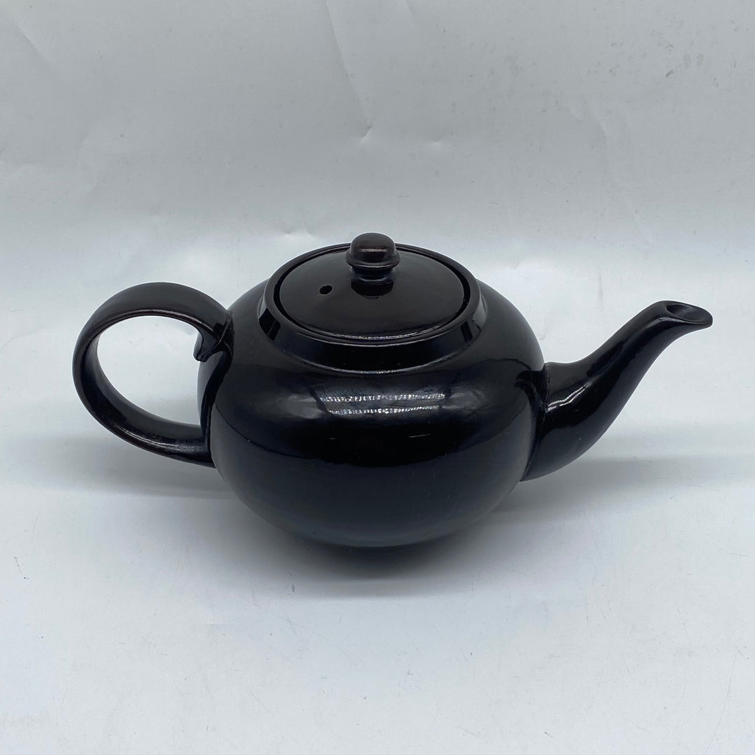 Elegant svart tekanna i keramik